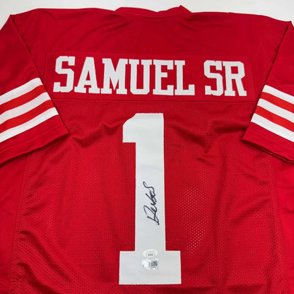 Red custom jersey with white number 1 and signature from Samuel SR in professional sports league