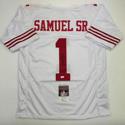 White professional sports league football jersey with red lettering and signed memorabilia