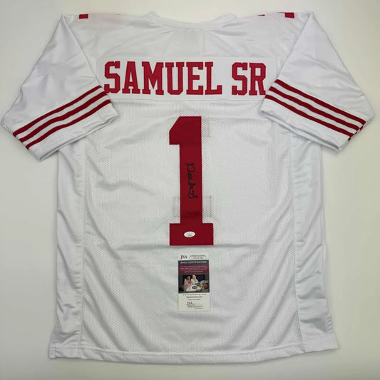 White professional sports league football jersey with red lettering and signed memorabilia