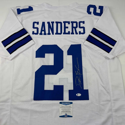 Back of a white mesh custom jersey with blue lettering and numbers featuring sanders 21 signed for professional sports league