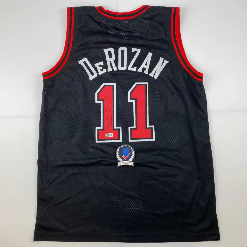 Autographed DeMar DeRozan custom Chicago Bulls black jersey with red trim and number 11