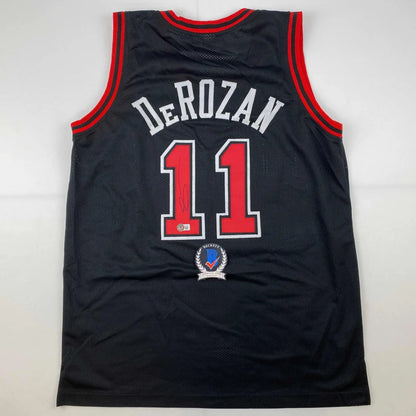 Autographed DeMar DeRozan custom Chicago Bulls black jersey with red trim and number 11