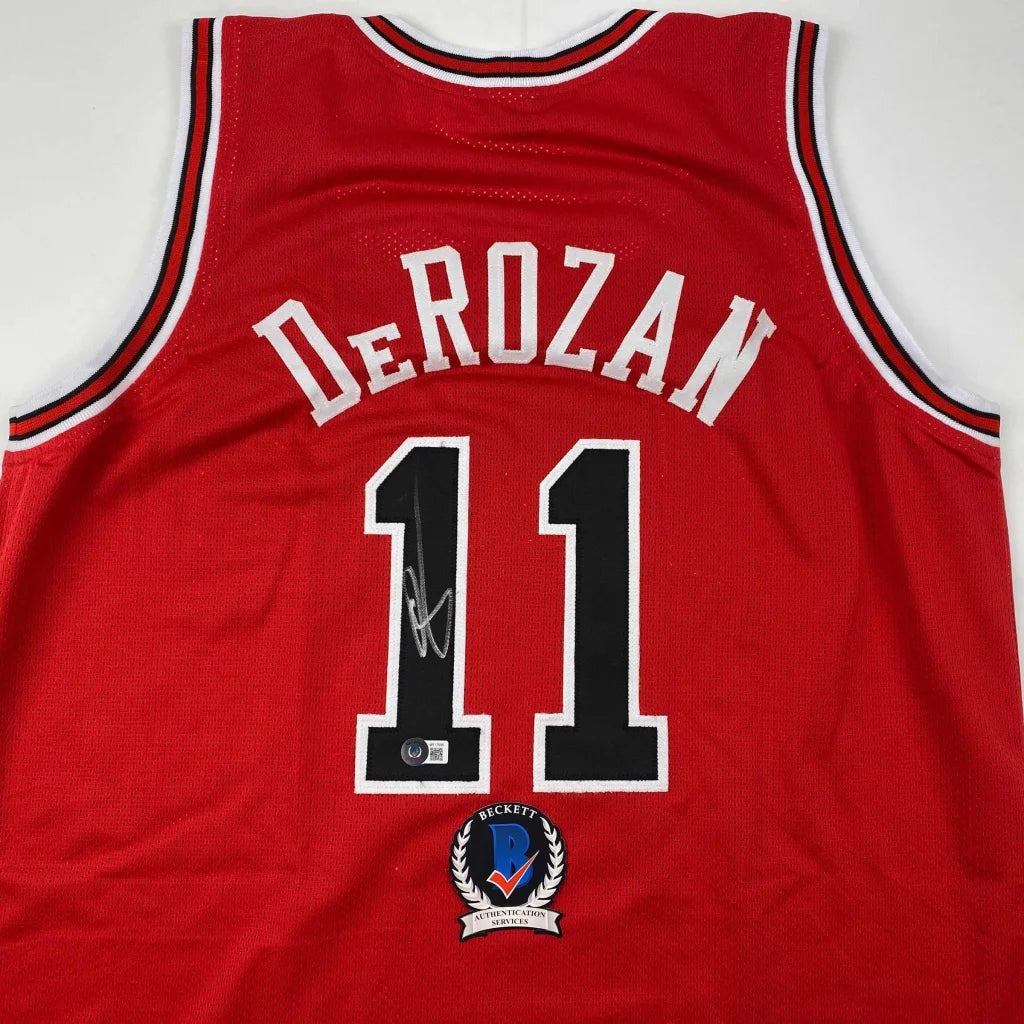 Red custom jersey with DeRozan 11 autograph, perfect for professional sports fans