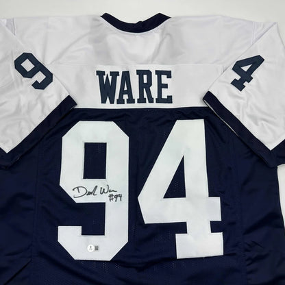 Autographed Demarcus Ware custom jersey in white and navy blue with 94, Beckett BAS COA