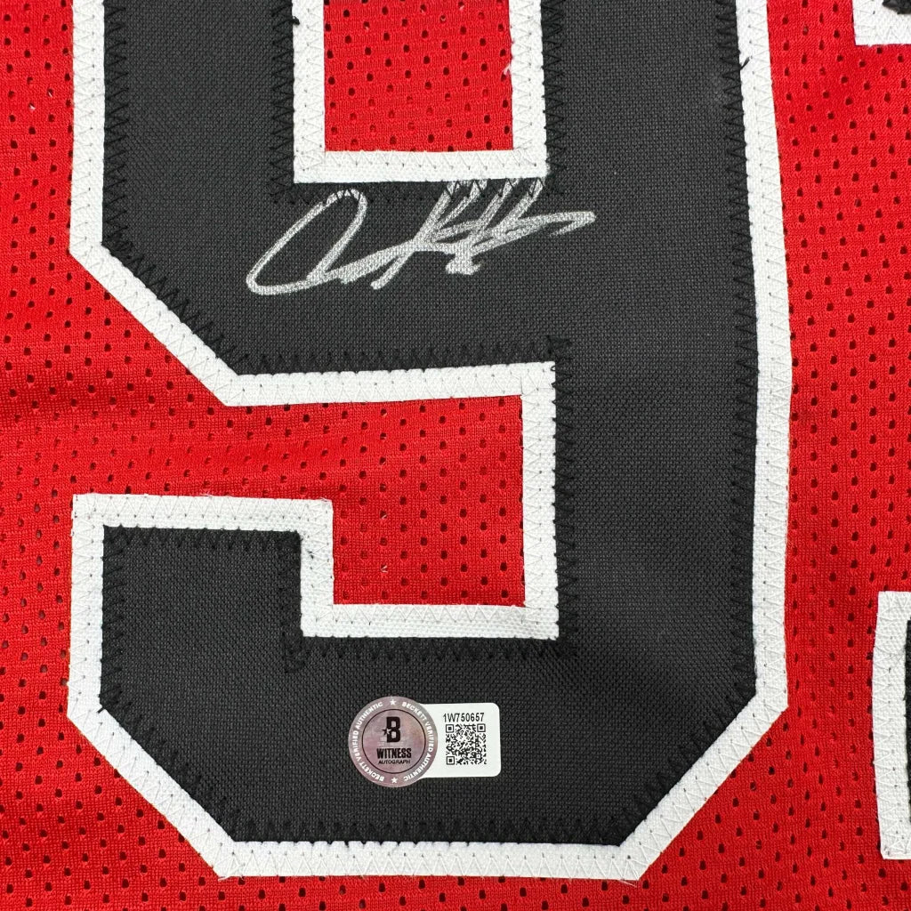 Red and black custom jersey with autograph from a professional sports league player