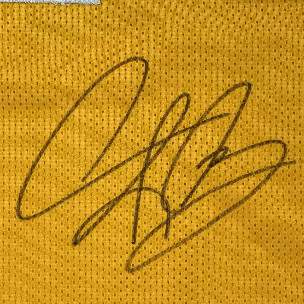 Black ink signature on yellow mesh fabric of autographed dennis rodman los angeles custom jersey for professional sports league