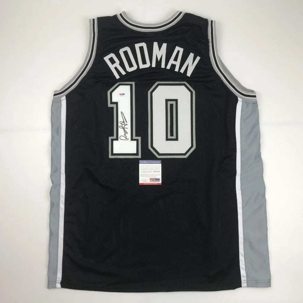Autographed Dennis Rodman custom jersey in black with white and silver lettering, name Roodman and number 10, PSA/DNA COA, professional sports league