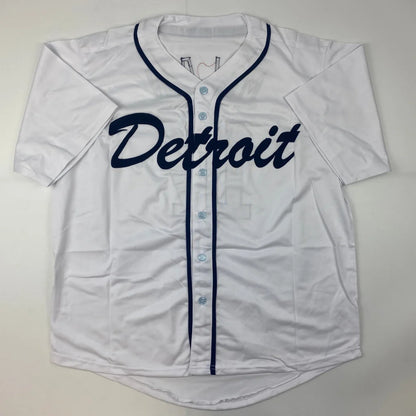 White short-sleeved baseball jersey with dark blue piping and Detroit embroidery for professional sports fans