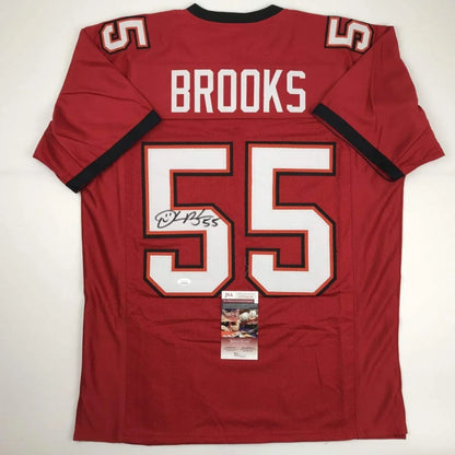 Back of a red custom football jersey with white and black trim featuring brooks 55 from professional sports league