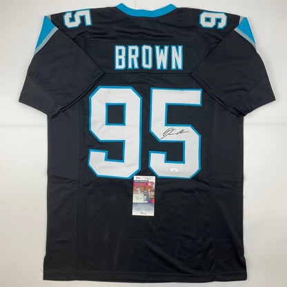 Black Carolina Panthers jersey with BROWN 95 signed by athlete, perfect for professional sports fans