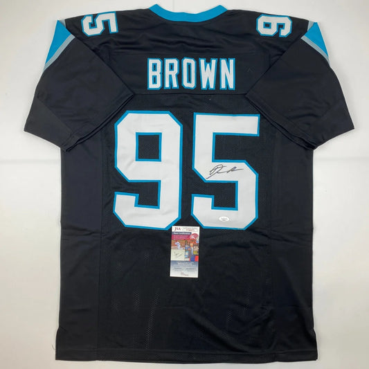 Black Carolina Panthers jersey with BROWN 95 signed by athlete, perfect for professional sports fans