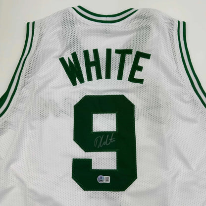 White mesh basketball custom jersey with green lettering number 9 and autograph signed by derrick white from professional sports league