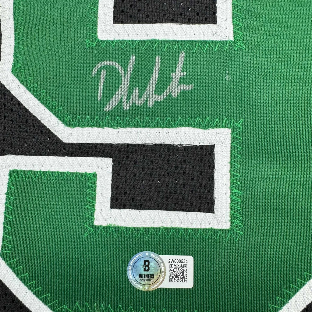 Autographed green and black mesh basketball jersey with white trim and authentication sticker from professional sports league