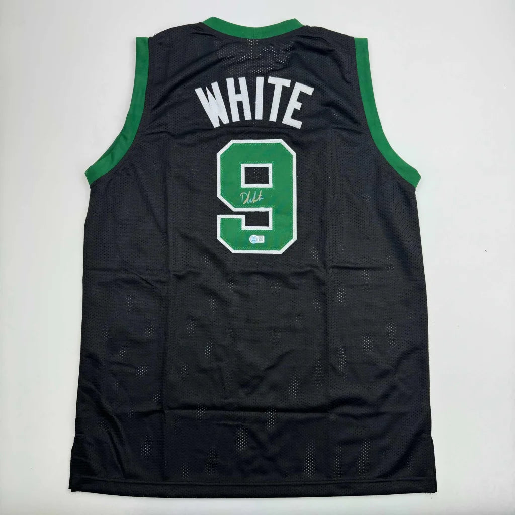 Back of black mesh basketball jersey with green trim white lettering custom jersey signed by derrick white pro sports league
