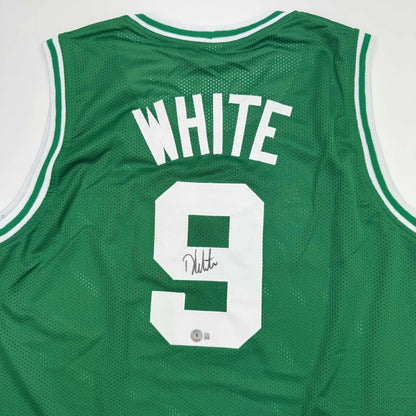Signed green custom basketball jersey with number 9, perfect for professional sports fans