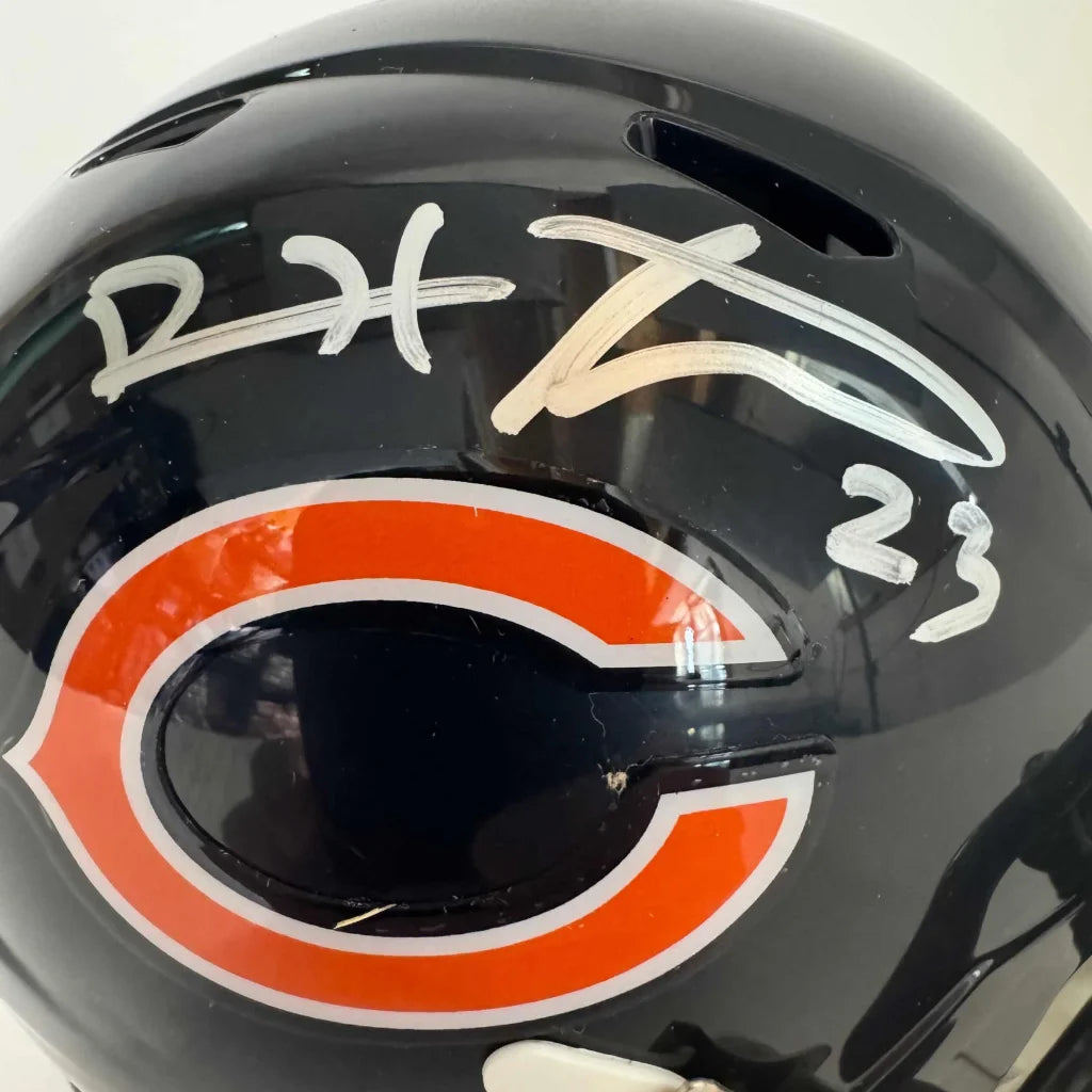 Black Chicago Bears helmet with PSA certified autograph and 23 written on it