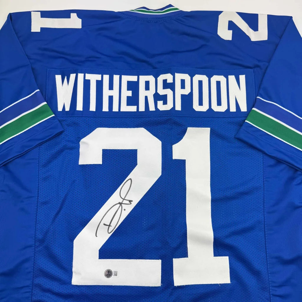 Autographed Devon Witherspoon Seattle Blue Retro Football Jersey Beckett BAS COA | Certified Authentic Signed Memorabilia | vintageantiquesgifts.com