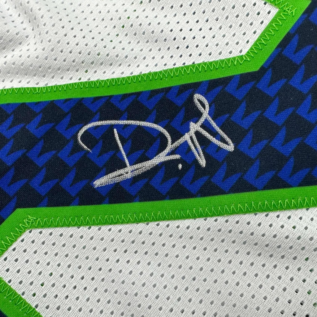 Autographed white and blue custom jersey from a professional sports league collectible
