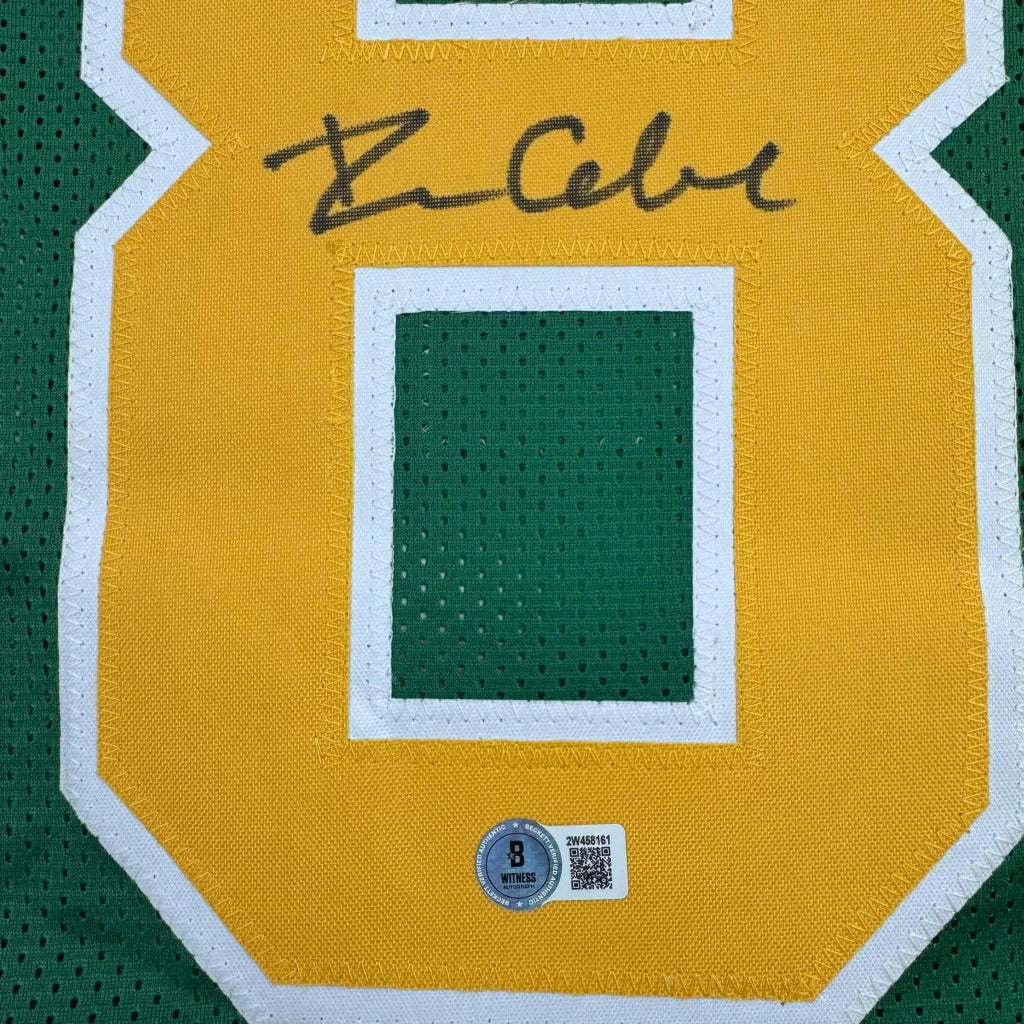 Green and gold custom jersey with autograph and authenticity sticker for professional sports fans