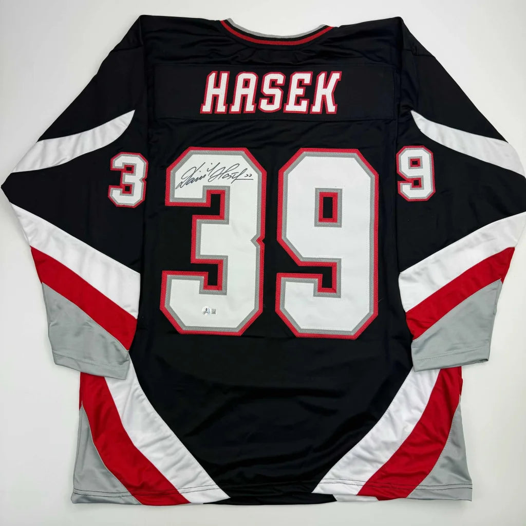 Autographed Dominik Hasek custom jersey with Hasek 39 on black Buffalo Sabres NHL pro sports jersey