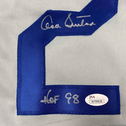 Blue number 2 embroidered on white fabric of Authentic Don Sutton custom jersey from professional sports league