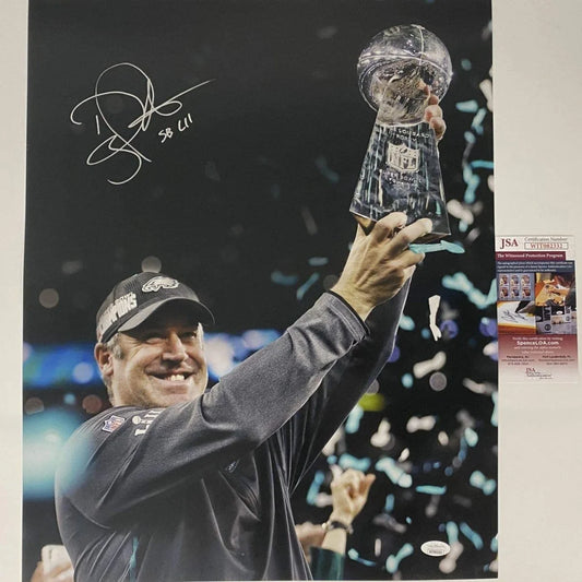 Autographed photo of smiling man in baseball cap holding Super Bowl LII trophy