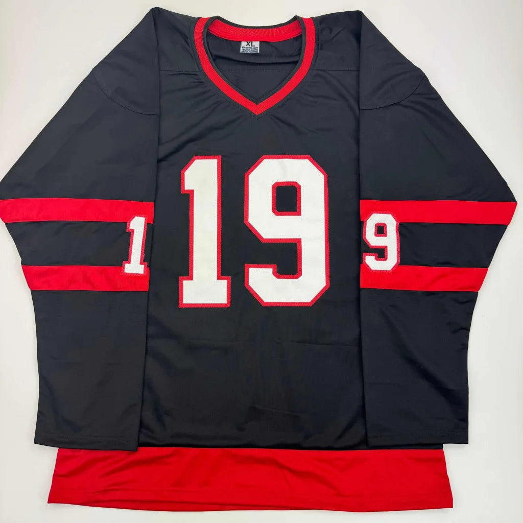 Black athletic jersey with red trim and white 19 for professional sports league fans