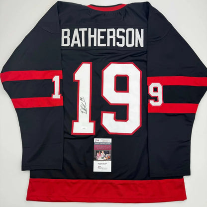 Black and red BATHERSO 19 hockey jersey with signature, perfect for professional sports fans