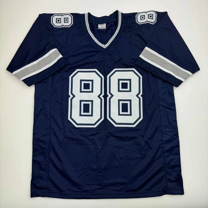 Navy blue custom football jersey with white silver accents number 88 autographed by drew pearson for professional sports league