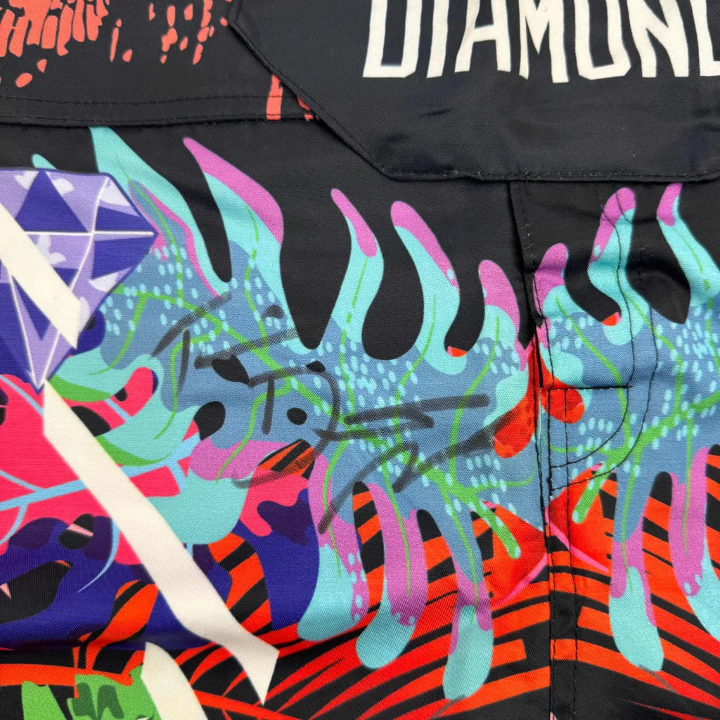 Colorful Tropical Flame Athletic Shorts with graphic flames and abstract shapes