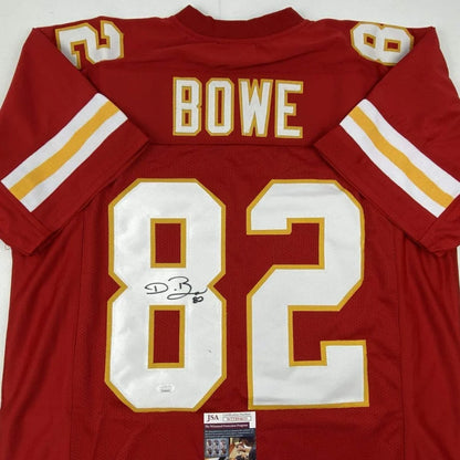 Back of a red kansas city chiefs custom jersey with white and gold lettering signed by dwayne bowe from professional sports league