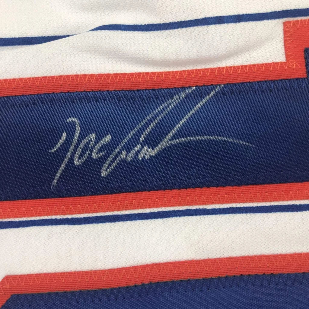 Blue and white custom jersey with autograph from a professional sports league star