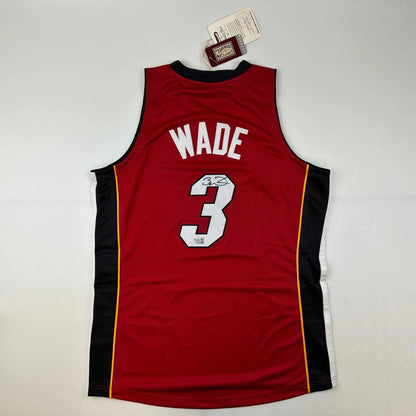 Red Miami Heat Dwyane Wade jersey with autograph, verified by third party authentication