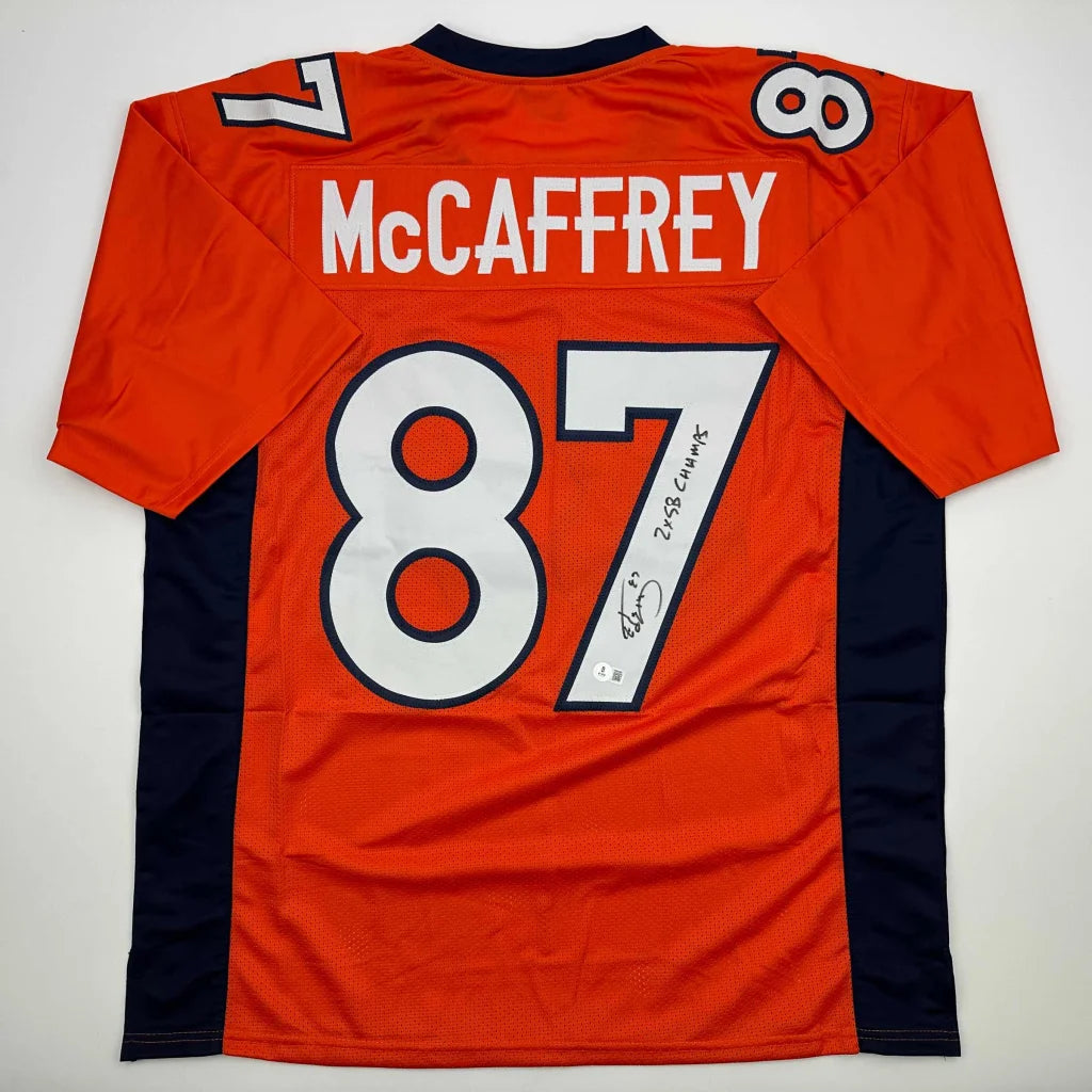 Orange Ed McCaffrey Denver Broncos jersey with signature, perfect for professional sports fans