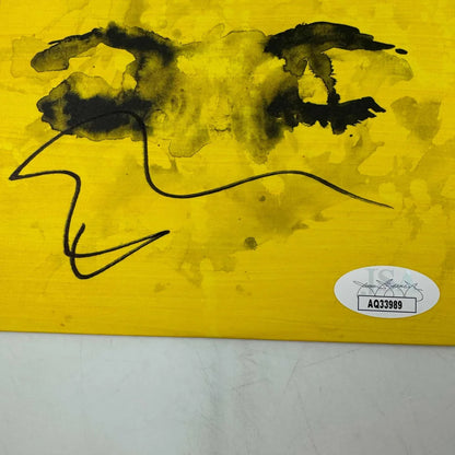 Vibrant yellow abstract painting with black ink splatters on Ed Sheeran Eyes Closed CD