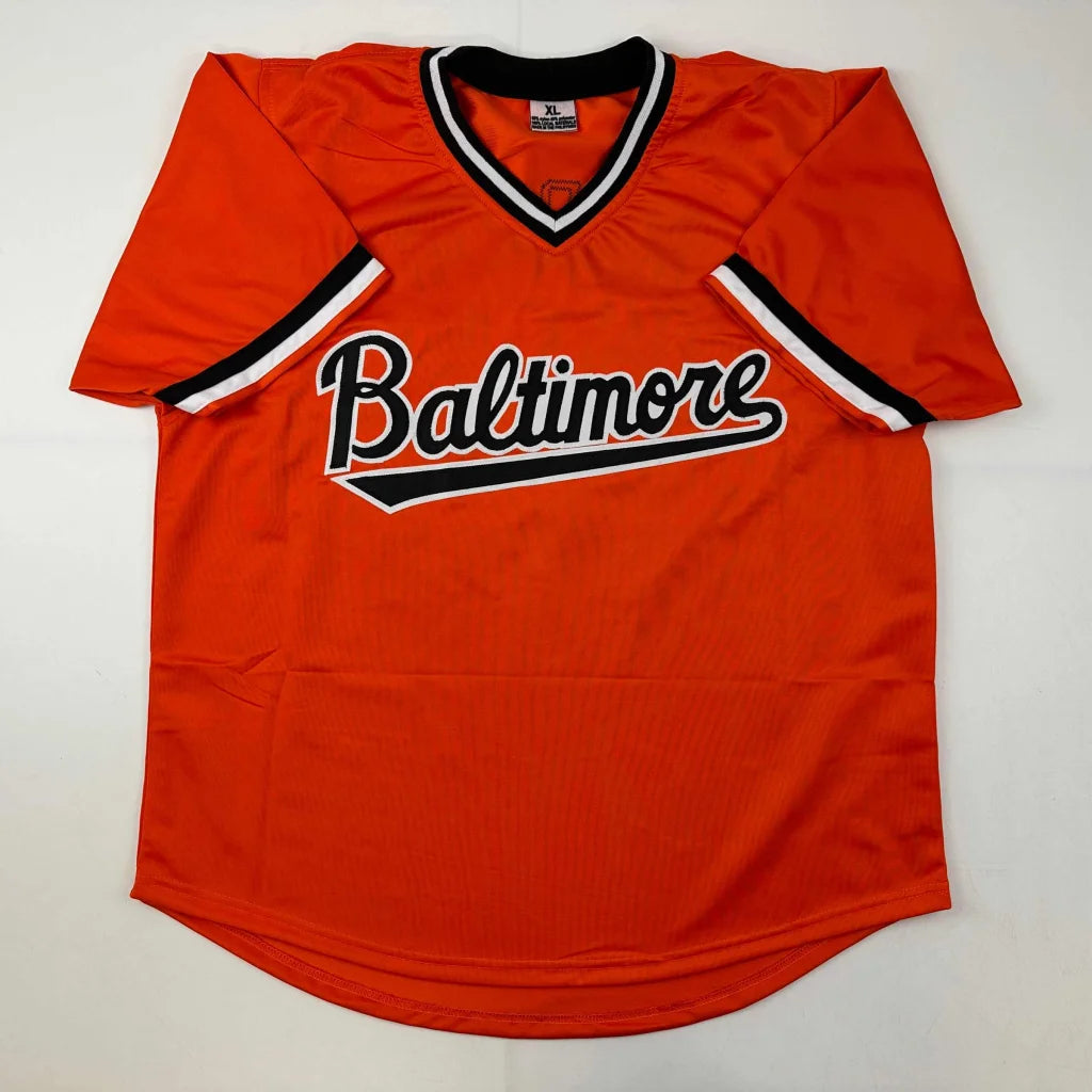 Orange V-neck baseball jersey with Baltimore across the chest, part of a professional sports league