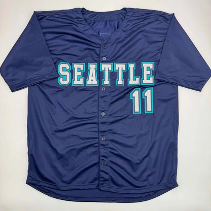 Dark blue professional sports league jersey with SEATTLE and 11 in teal and white lettering