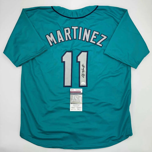 Teal custom jersey from professional sports league with Martinez 11 signature and authentication