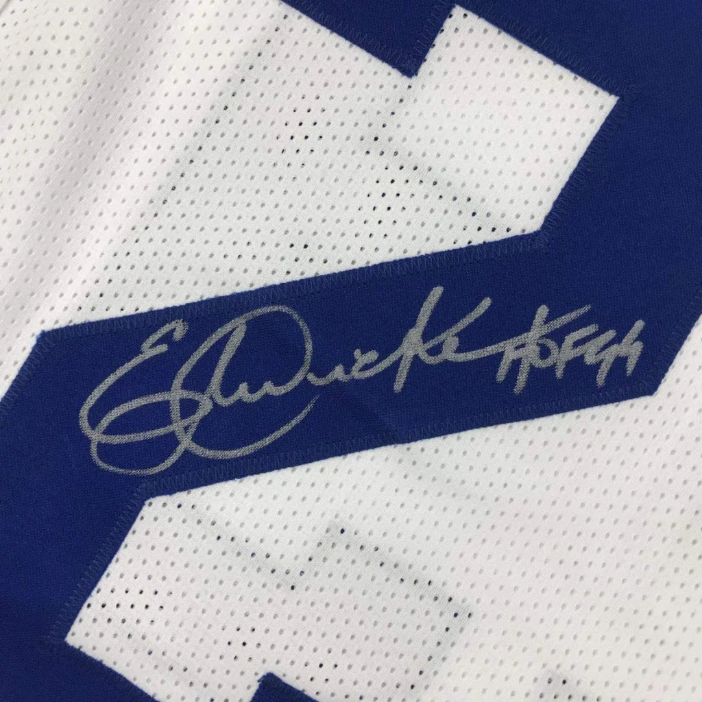 Autographed white and blue custom jersey from professional sports league featuring Eric Dickerson