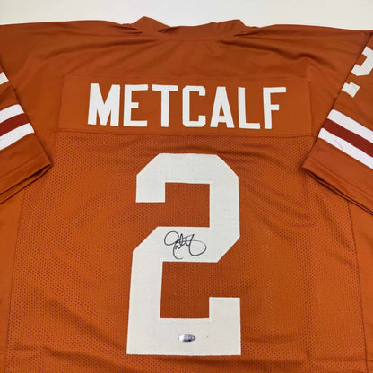 Autographed Eric Metcalf Texas Orange College Football Jersey Beckett BAS COA | Certified Authentic Signed Memorabilia | vintageantiquesgifts.com
