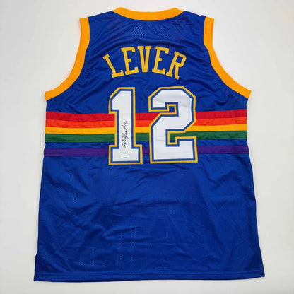 Royal blue custom jersey from professional sports league with rainbow stripe and signature
