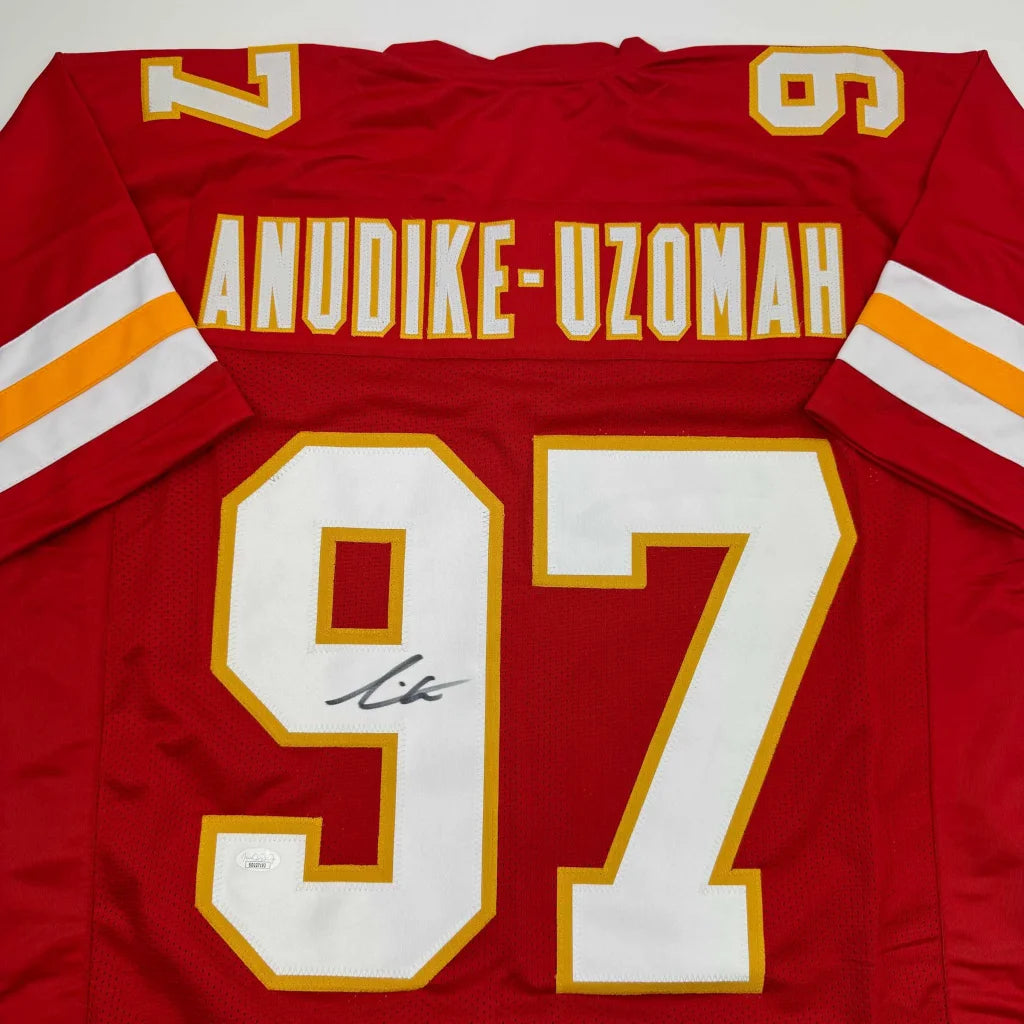 Red custom jersey from a professional sports league with number 97 and signature