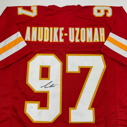 Red custom jersey from a professional sports league with number 97 and signature