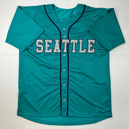 Teal custom jersey with dark trim and front buttons for professional sports league