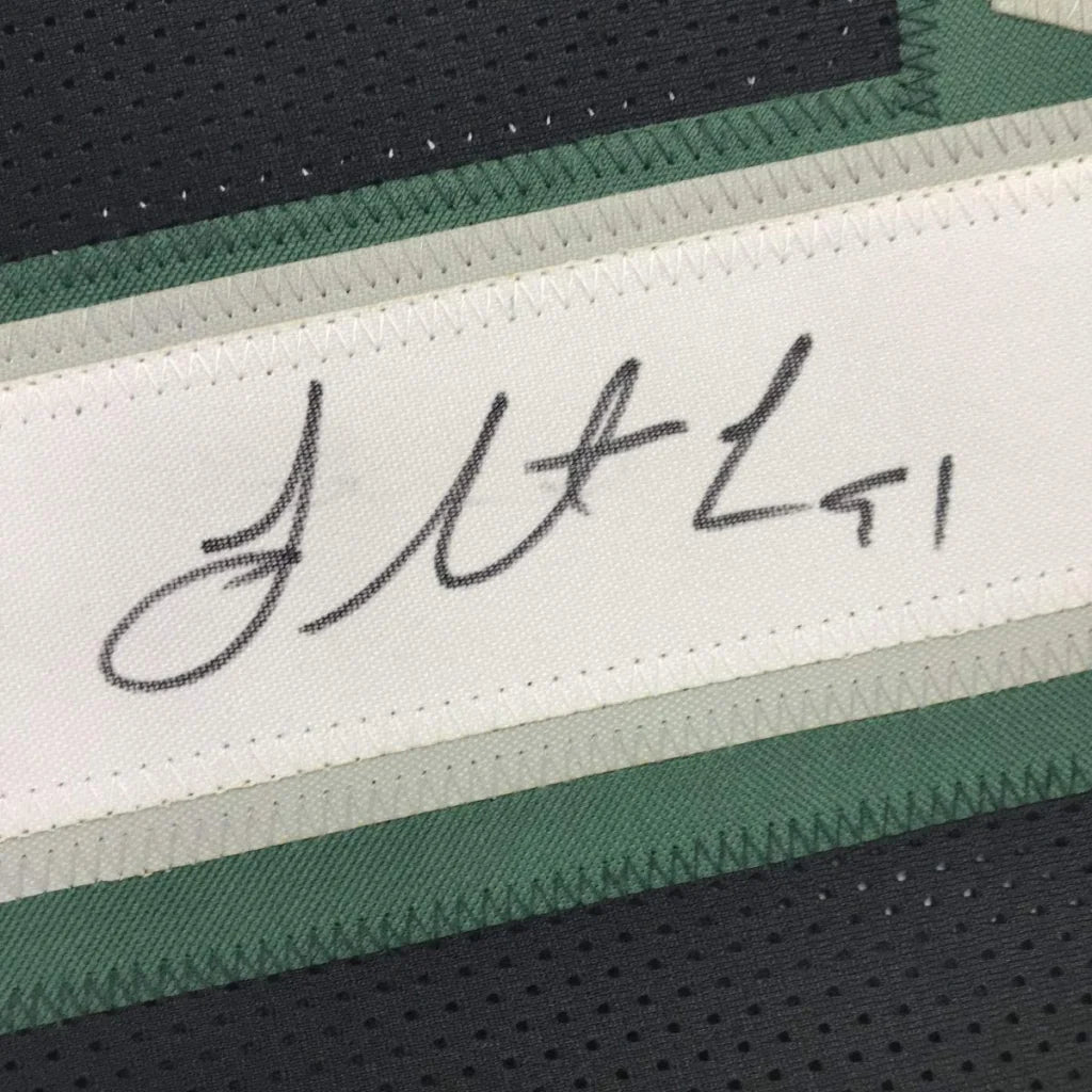 Black and green custom jersey with signature, perfect for professional sports fans