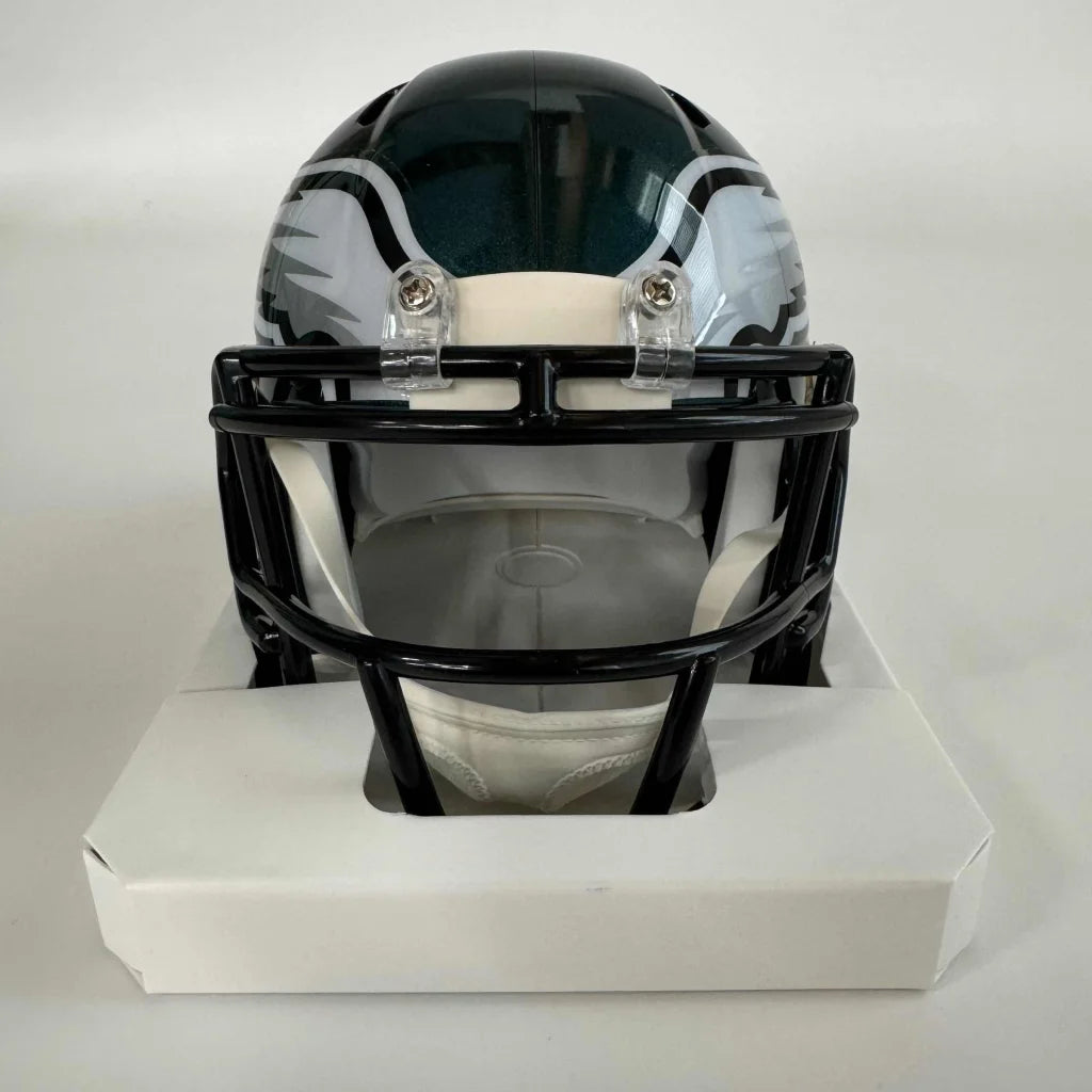 Green and white Philadelphia Eagles mini helmet with black facemask, third-party authenticated