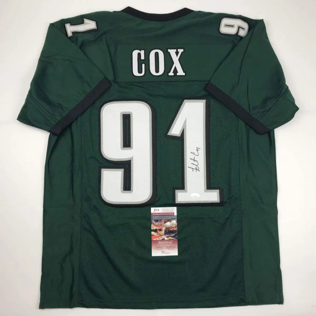 Dark green custom jersey with white numbers, autograph, and authentication sticker for professional sports league