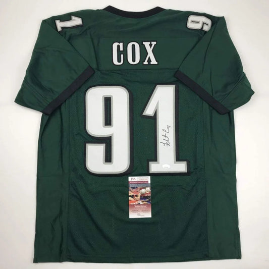 Dark green custom jersey with white numbers, autograph, and authentication sticker for professional sports league