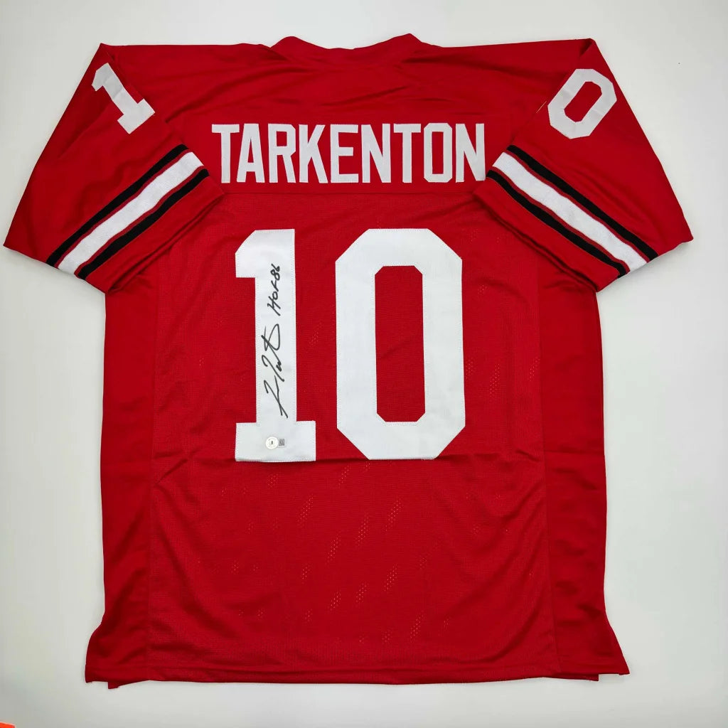 Red custom jersey with number 10 signed, perfect for professional sports fans