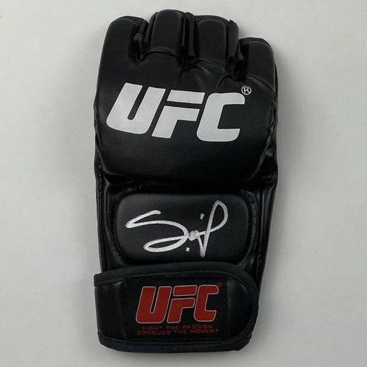 Black UFC MMA glove with white autograph, verified with third party authentication